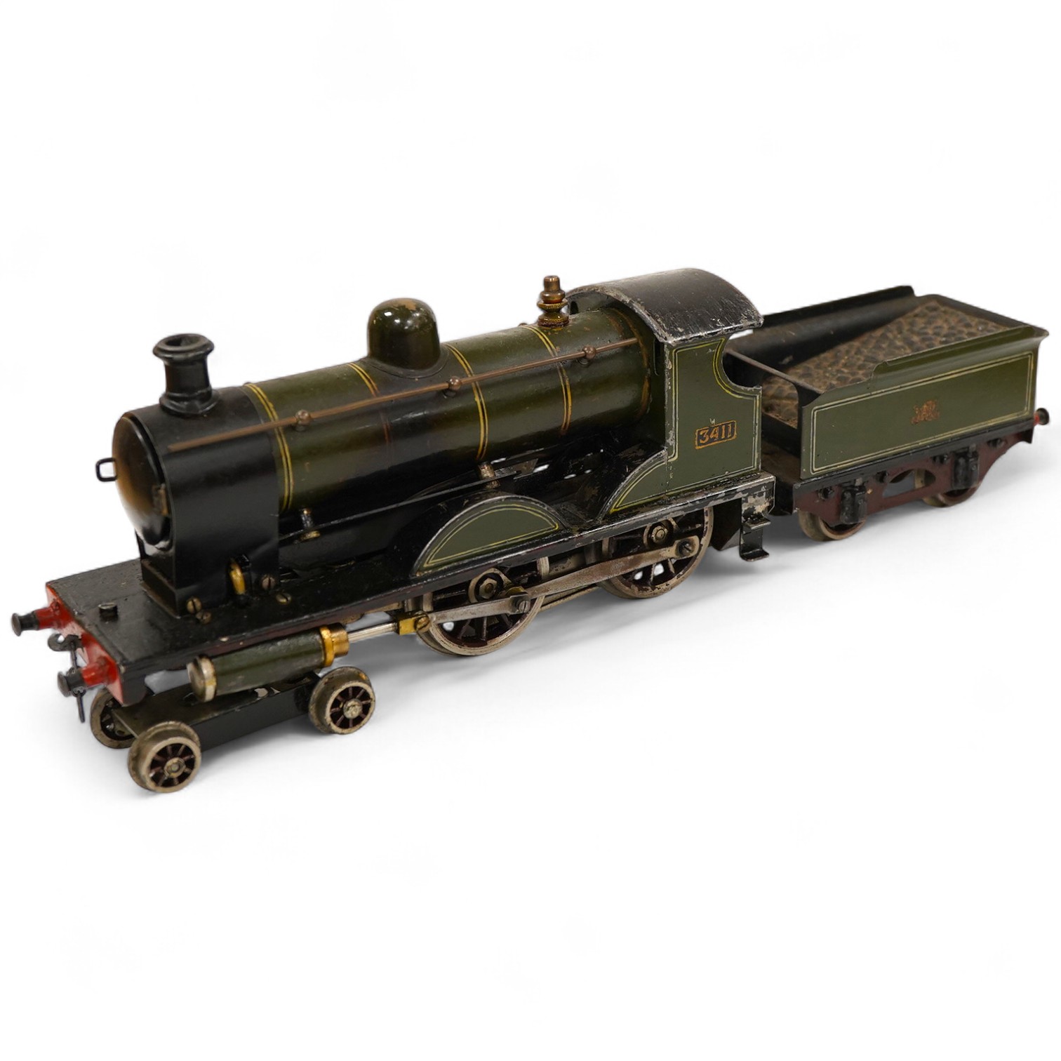 An 0 gauge live steam spirit fired tinplate GWR 4-4-0 tender locomotive, possibly Bing for Bassett-Lowke, 3411, with original fuel tank and burner, two controls in the cab and four wheel tender